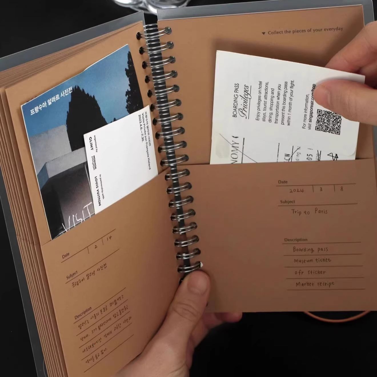 A5 kraft paper travel journal open showing frosted paper pocket page and kraft pocket page side by side