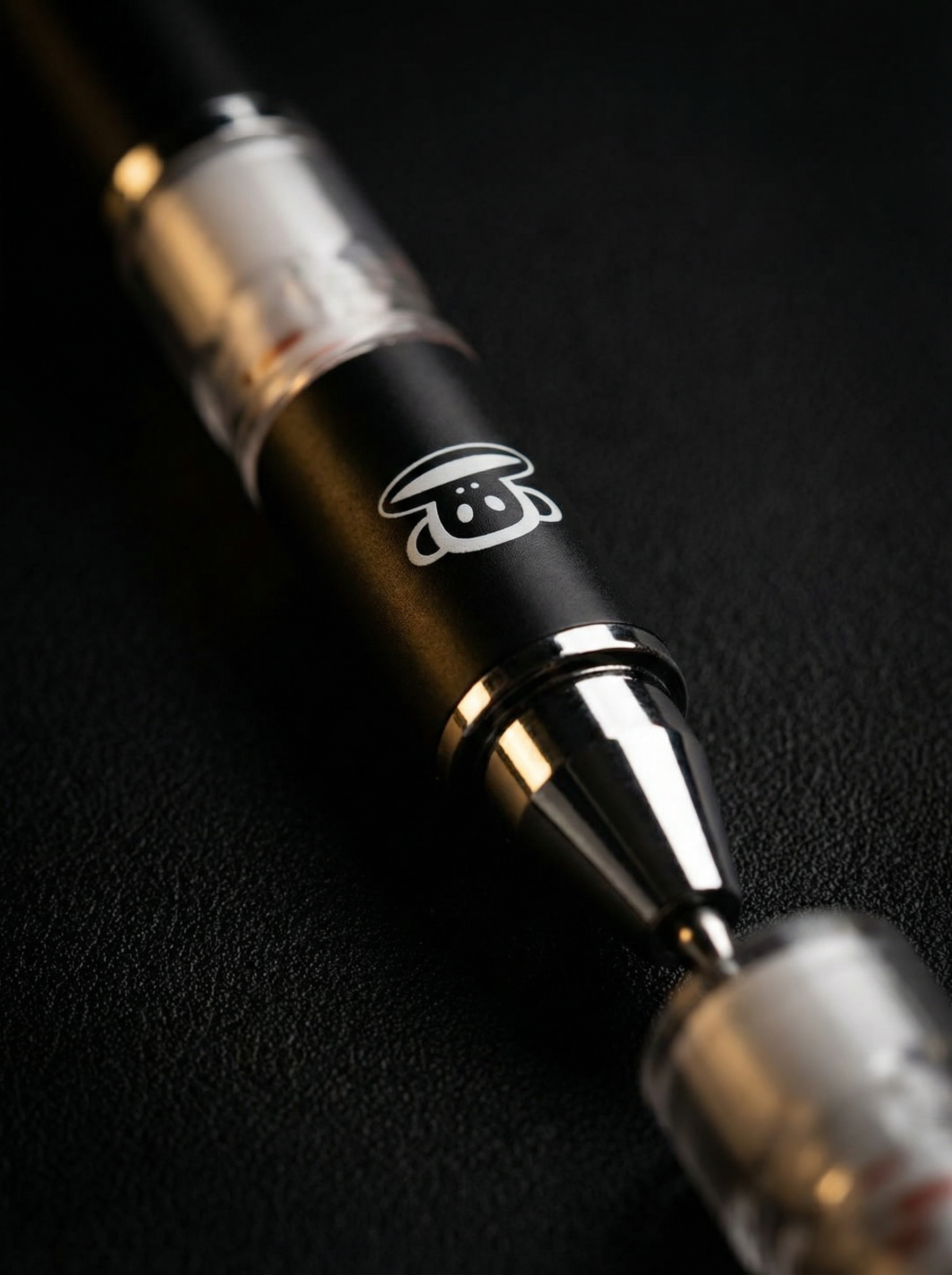 Paul Frank Mechanical Pencil premium close-up macro shot of monkey logo and chrome tip